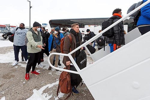 MIKE DEAL / WINNIPEG FREE PRESS
Winnipeg Blue Bombers Adam Bighill heads up the stairs during boarding of the plane to Hamilton for the 108th Grey Cup Tuesday afternoon.
211207 - Tuesday, December 07, 2021.