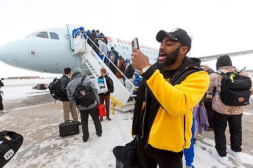 MIKE DEAL / WINNIPEG FREE PRESS
Winnipeg Blue Bombers Rasheed Bailey records the boarding their plane to Hamilton for the 108th Grey Cup Tuesday afternoon.
211207 - Tuesday, December 07, 2021.