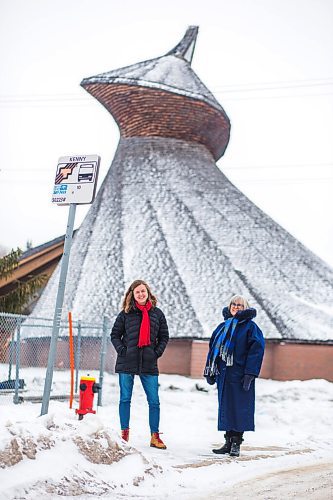 MIKAELA MACKENZIE / WINNIPEG FREE PRESS

Julie Penner, audio producer, and Susan Algie, executive director of the Winnipeg Architecture Foundation, pose for a portrait at a #10 bus stop in front of Precious Blood church in Winnipeg on Wednesday, Dec. 8, 2021. The two worked on Archi10, a new app that delivers an audio tour of local buildings while travelling along the #10 bus route. For Eva story.
Winnipeg Free Press 2021.