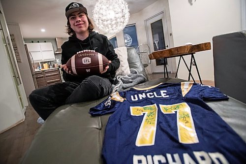 Daniel Crump / Winnipeg Free Press. AJ Boyko holds the ball that nearly hit him on Saturday during the CFL west division when a Saskatchewan Roughriders player allegedly threw the ball into the crowd in an attempt to hit a heckling fan. December 8, 2021.