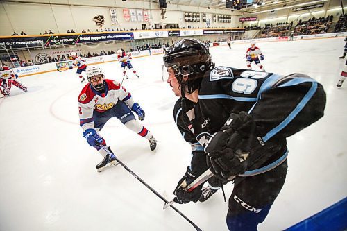 Daniel Crump / Winnipeg Free Press. Winnipeg Ice center Matthew Savoie plays the puck along the boards. The Winnipeg Ice take on the Edmonton Oil Kings at Wayne Fleming arena in Winnipeg. The Ice currently sit in first place atop the Chloroformed standing, while the Oil Kings are just below in second place. December 8, 2021.