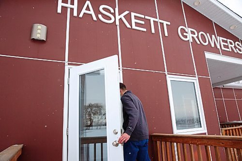 MIKE DEAL / WINNIPEG FREE PRESS
An employee of Haskett Growers photographs Winnipeg Free Press car after reporter requested to speak to Harold Thiessen at their office south of Winkler, MB.
211208 - Wednesday, December 08, 2021.