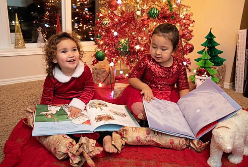 JESSICA LEE / WINNIPEG FREE PRESS

Jessica (left), 2, and Quinn, 4, are photographed in their home reading Christmas books on December 7, 2021.













