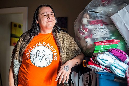 MIKAELA MACKENZIE / WINNIPEG FREE PRESS

Alaya McIvor poses for a portrait with Christmas donations for residential school survivors in Winnipeg on Thursday, Dec. 9, 2021. For Tyler story.
Winnipeg Free Press 2021.