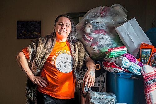 MIKAELA MACKENZIE / WINNIPEG FREE PRESS

Alaya McIvor poses for a portrait with Christmas donations for residential school survivors in Winnipeg on Thursday, Dec. 9, 2021. For Tyler story.
Winnipeg Free Press 2021.