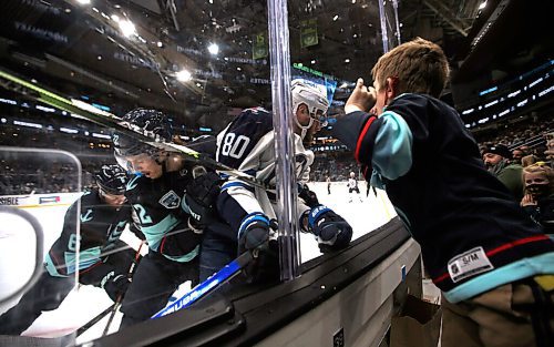 Winnipeg Jets' Pierre-Luc Dubois (80) gets a warm welcome from a young Kraken fan during third period NHL hockey action in Seattle, Washington, Thursday, December 9, 2021. (TREVOR HAGAN / WINNIPEG FREE PRESS)