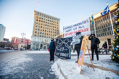 MIKAELA MACKENZIE / WINNIPEG FREE PRESS

Anny Chen (left), Carol Owens, and Paul Santos with Budget for All demonstrate outside of City Hall in Winnipeg on Friday, Dec. 10, 2021. For Joyanne story.
Winnipeg Free Press 2021.