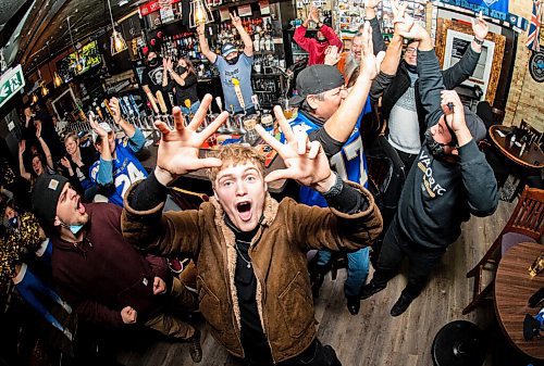 Mike Sudoma / Winnipeg Free Press
Winnipeg Blue Bombers fan Owen Larsen, rejoices with fellow Bombers fans at the Kingshead Pub Sunday evening as the Bombers take the Hamilton Tiger Cats in overtime to win the 2021 Grey Cup
December 12, 2021