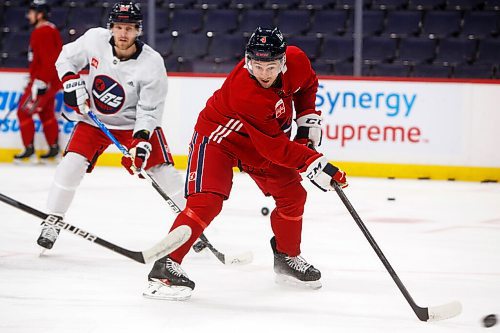 MIKE DEAL / WINNIPEG FREE PRESS
Winnipeg Jets' Neal Pionk (4) during practice at Canada Life Centre Monday morning.
211213 - Monday, December 13, 2021.