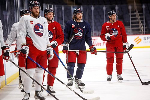 MIKE DEAL / WINNIPEG FREE PRESS
Winnipeg Jets' Pierre-Luc Dubois (80), Josh Morrissey (44), Nathan Beaulieu (28) and Dylan DeMelo (2) during practice at Canada Life Centre Monday morning.
211213 - Monday, December 13, 2021.