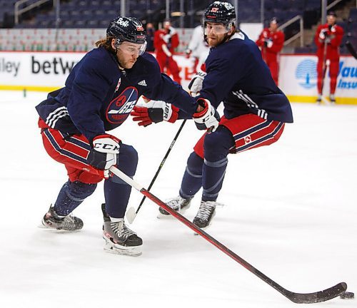 MIKE DEAL / WINNIPEG FREE PRESS
Winnipeg Jets' Nathan Beaulieu (28) during practice at Canada Life Centre Monday morning.
211213 - Monday, December 13, 2021.