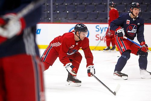 MIKE DEAL / WINNIPEG FREE PRESS
Winnipeg Jets' Neal Pionk (4) during practice at Canada Life Centre Monday morning.
211213 - Monday, December 13, 2021.