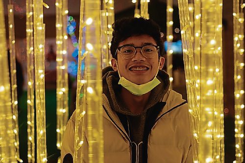 Canstar Community News Marc Tinton explores the swinging light columns at the Lights of the North display.