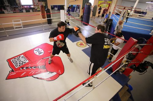 Brandon Sun Noel Harding, left, spars with head boxing coach Mike Frederickson in the ring at the Brandon Boxing Club. Classes for beginners are held on Monday and Wednesday evening starting at 6:30 p.m. FOR JILLIAN (Bruce Bumstead/Brandon Sun)