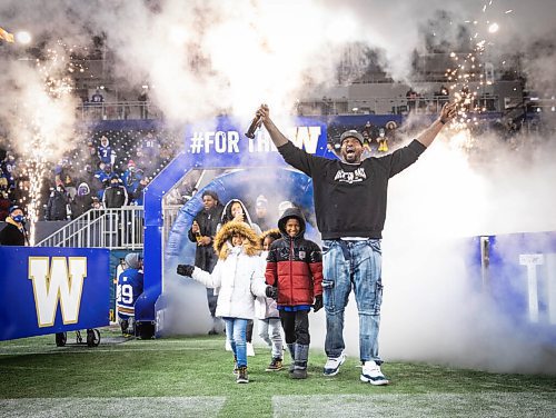 JESSICA LEE / WINNIPEG FREE PRESS

Bombers player Jermarcus Hardrick celebrates the recent Grey Cup victory with his family at IG Field on December 15, 2021.












