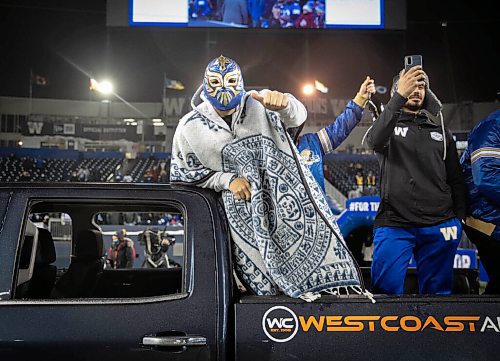 JESSICA LEE / WINNIPEG FREE PRESS

Bombers player Sergio Castillo (in mask) celebrates the recent Grey Cup victory at IG Field on December 15, 2021.














