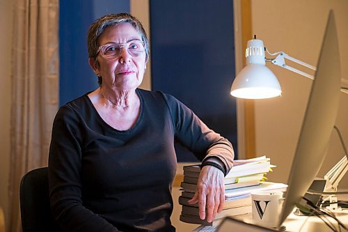 MIKAELA MACKENZIE / WINNIPEG FREE PRESS

Virginia Page Jähne, a 72-year-old PhD student at the U of M who is hesitant about the university's plans to fully reopen to pre-pandemic levels in early 2022, poses for a portrait in her home work space in Winnipeg on Thursday, Dec. 16, 2021. For Maggie story.
Winnipeg Free Press 2021.