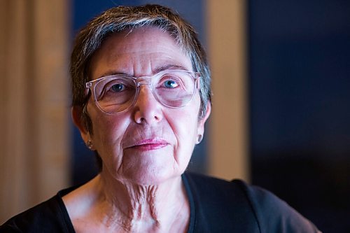 MIKAELA MACKENZIE / WINNIPEG FREE PRESS

Virginia Page Jähne, a 72-year-old PhD student at the U of M who is hesitant about the university's plans to fully reopen to pre-pandemic levels in early 2022, poses for a portrait in her home work space in Winnipeg on Thursday, Dec. 16, 2021. For Maggie story.
Winnipeg Free Press 2021.