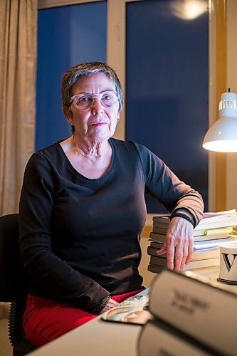 MIKAELA MACKENZIE / WINNIPEG FREE PRESS

Virginia Page Jähne, a 72-year-old PhD student at the U of M who is hesitant about the university's plans to fully reopen to pre-pandemic levels in early 2022, poses for a portrait in her home work space in Winnipeg on Thursday, Dec. 16, 2021. For Maggie story.
Winnipeg Free Press 2021.