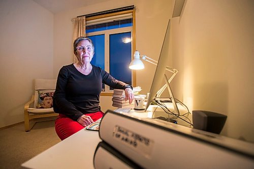 MIKAELA MACKENZIE / WINNIPEG FREE PRESS

Virginia Page Jähne, a 72-year-old PhD student at the U of M who is hesitant about the university's plans to fully reopen to pre-pandemic levels in early 2022, poses for a portrait in her home work space in Winnipeg on Thursday, Dec. 16, 2021. For Maggie story.
Winnipeg Free Press 2021.