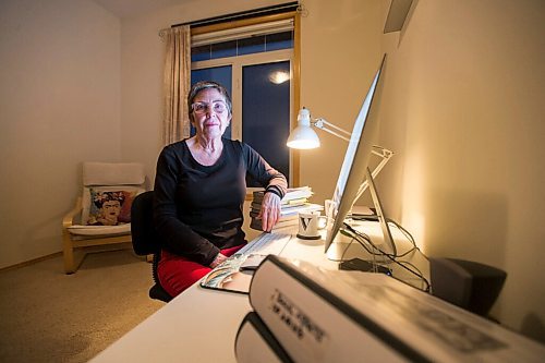 MIKAELA MACKENZIE / WINNIPEG FREE PRESS

Virginia Page Jähne, a 72-year-old PhD student at the U of M who is hesitant about the university's plans to fully reopen to pre-pandemic levels in early 2022, poses for a portrait in her home work space in Winnipeg on Thursday, Dec. 16, 2021. For Maggie story.
Winnipeg Free Press 2021.