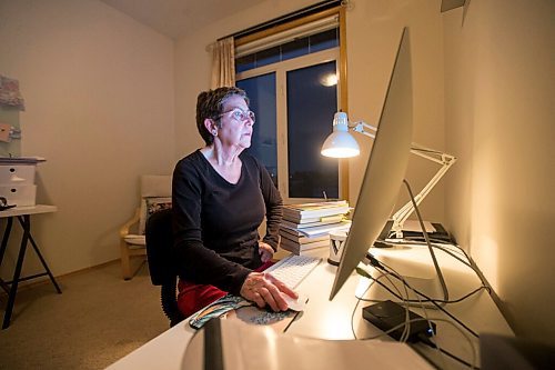 MIKAELA MACKENZIE / WINNIPEG FREE PRESS

Virginia Page Jähne, a 72-year-old PhD student at the U of M who is hesitant about the university's plans to fully reopen to pre-pandemic levels in early 2022, poses for a portrait in her home work space in Winnipeg on Thursday, Dec. 16, 2021. For Maggie story.
Winnipeg Free Press 2021.