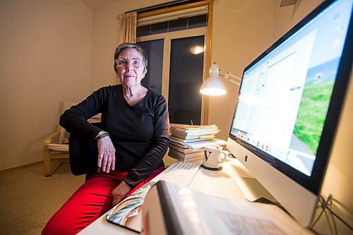 MIKAELA MACKENZIE / WINNIPEG FREE PRESS

Virginia Page Jähne, a 72-year-old PhD student at the U of M who is hesitant about the university's plans to fully reopen to pre-pandemic levels in early 2022, poses for a portrait in her home work space in Winnipeg on Thursday, Dec. 16, 2021. For Maggie story.
Winnipeg Free Press 2021.