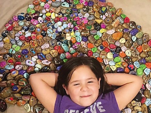 Canstar Community News Brooklyn Larkin poses with some of the 412 Hospital Hero rocks she painted with her family and which they dropped off at Grace and St. Boniface hospitals.