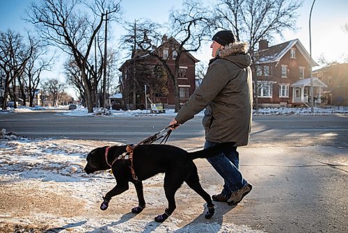 JESSICA LEE / WINNIPEG FREE PRESS

Vic Pereira walks with his guide dog Porthos near his home on Wellington Crescent on December 20, 2021. Pereira thinks the city should require those who own homes or businesses to shovel the sidewalks beside them.

Reporter: Joyanne













