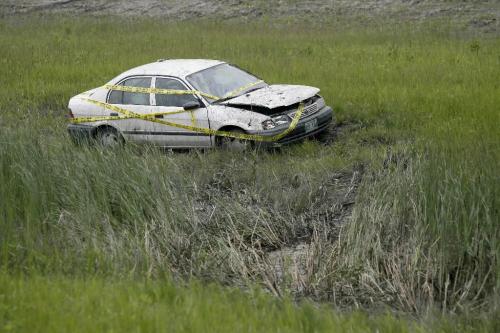 MIKE.DEAL@FREEPRESS.MB.CA 100624 - Thursday, June 24th, 2010 A car sits on the other side of a ditch after being driven off Hwy 59 south bound. Two people were taken to hospital injuries unknown. MIKE DEAL / WINNIPEG FREE PRESS