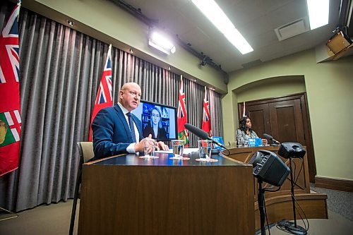 MIKAELA MACKENZIE / WINNIPEG FREE PRESS

Chief provincial public health officer Dr. Brent Roussin (left) and health minister Audrey Gordon speak at a press conference asking the public to adjust their holiday plans at the Manitoba Legislative Building in Winnipeg on Friday, Dec. 24, 2021.  For Malak story.
Winnipeg Free Press 2021.