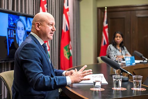 MIKAELA MACKENZIE / WINNIPEG FREE PRESS

Chief provincial public health officer Dr. Brent Roussin (left) and health minister Audrey Gordon speak at a press conference asking the public to adjust their holiday plans at the Manitoba Legislative Building in Winnipeg on Friday, Dec. 24, 2021.  For Malak story.
Winnipeg Free Press 2021.