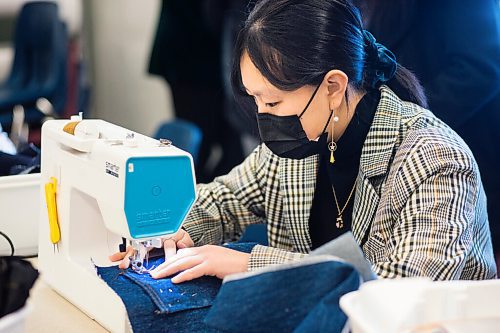 MIKAELA MACKENZIE / WINNIPEG FREE PRESS

Grade 11 student Angelin Hou works on making her own jeans during textiles class at Shaftesbury High School in Winnipeg on Wednesday, Dec. 22, 2021. For Maggie story.
Winnipeg Free Press 2021.