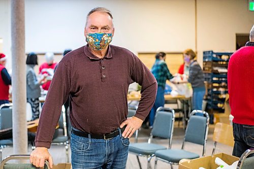 MIKAELA MACKENZIE / WINNIPEG FREE PRESS

George Hill poses for a portrait as volunteers at the Mission Baptist Church pack up hot Christmas meals in Winnipeg on Saturday, Dec. 25, 2021.  For Malak story.
Winnipeg Free Press 2021.