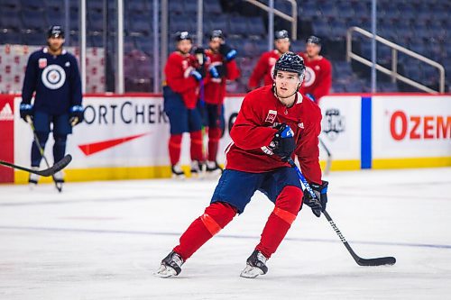 MIKAELA MACKENZIE / WINNIPEG FREE PRESS

Ville Heinola (14) skates at Jets practice at the Canada Life Centre in Winnipeg on Monday, Dec. 27, 2021.  For Mike McIntyre story.
Winnipeg Free Press 2021.