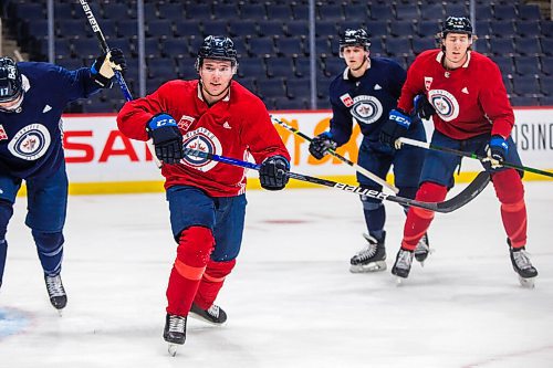 MIKAELA MACKENZIE / WINNIPEG FREE PRESS

Ville Heinola (14) skates at Jets practice at the Canada Life Centre in Winnipeg on Monday, Dec. 27, 2021.  For Mike McIntyre story.
Winnipeg Free Press 2021.