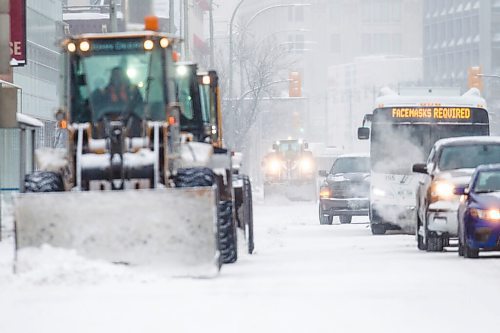 MIKAELA MACKENZIE / WINNIPEG FREE PRESS

Snowplows clear Portage Avenue in Winnipeg on Tuesday, Dec. 28, 2021. Standup.
Winnipeg Free Press 2021.