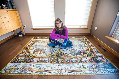 MIKAELA MACKENZIE / WINNIPEG FREE PRESS

Alexa Storozuk, 13, poses for a portrait with her completed 9,000 piece puzzle in her home in West St. Paul on Thursday, Dec. 30, 2021. For Bryce Hunt story.
Winnipeg Free Press 2021.