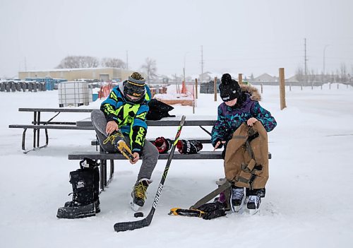 JESSICA LEE / WINNIPEG FREE PRESS

Sadie Lee, 12, and Nick Kazakoff, 12, remove their skates after spending the morning of January 4, 2022, skating at a new public rink at 2445 Waverley Street.









