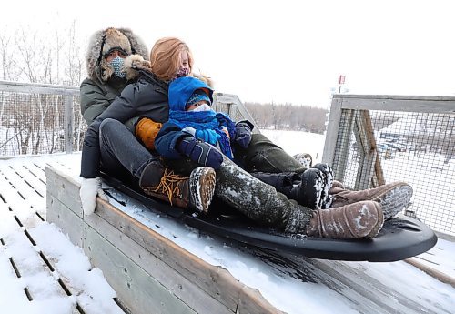 \RUTH BONNEVILLE / WINNIPEG FREE PRESS

Local - Tobogganing standup
Jessica Willow along with her husband Brett Willow and their son, Dylan (3yrs), brave the frigid cold and make a few runs down the toboggan slide at Fort Whyte Wednesday.  

Jessica Willow is  a teacher and decided to get some fresh air with her family and take advantage of Fort Whyte's annual teacher's appreciation day which offers free entry into Fort Whyte to teachers and their families.  

  
Jan 5th,  2022
