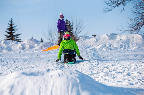 MIKAELA MACKENZIE / WINNIPEG FREE PRESS

Grace (11, front) and Isla (nine) Hill go sledding in Churchill Drive Park in Winnipeg on Thursday, Jan. 6, 2022. Standup.
Winnipeg Free Press 2022.