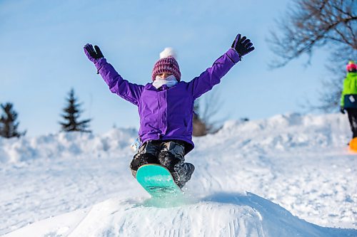 MIKAELA MACKENZIE / WINNIPEG FREE PRESS

Isla Hill (nine) goes over a jump while sledding in Churchill Drive Park in Winnipeg on Thursday, Jan. 6, 2022. Standup.
Winnipeg Free Press 2022.