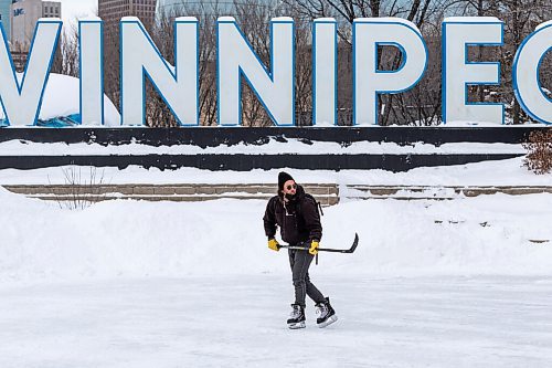 Daniel Crump / Winnipeg Free Press. Cole Brooks skates in front of the Winnipeg sign at the Forks Saturday afternoon. January 8, 2022.