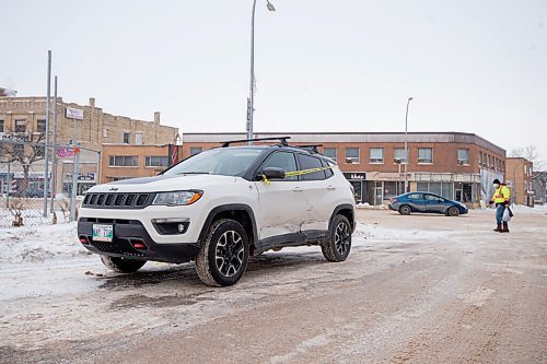 Mike Sudoma / Winnipeg Free Press
A car sits at the corner of Furby St and Portage Ave after being involved in a traffic accident because of the ruts along Portage Ave Tuesday
January 11, 2022