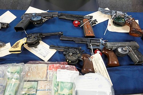 MIKE DEAL / WINNIPEG FREE PRESS
All types of guns were seized during the operation and only some were put out during the press conference.
Winnipeg Police Inspector Elton Hall of the Organized Crime Unit speaks about Operation Phoenix during a press conference at Winnipeg Police Headquarters Thursday morning.
See Erik Pindera story
220113 - Thursday, January 13, 2022.