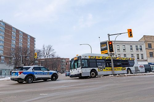 Daniel Crump / Winnipeg Free Press. Cadets tend to the seen after a bus crashed into a traffic light at the intersection of Portage Avenue and Sherbrooke Street Saturday afternoon. January 15, 2022.