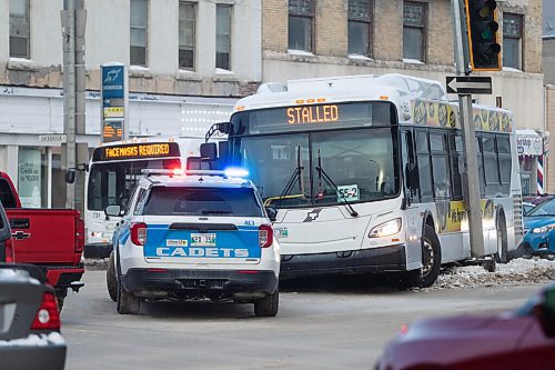 Daniel Crump / Winnipeg Free Press. Cadets tend to the seen after a bus crashed into a traffic light at the intersection of Portage Avenue and Sherbrooke Street Saturday afternoon. January 15, 2022.