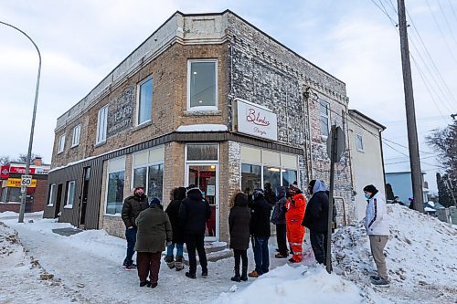 Daniel Crump / Winnipeg Free Press. People wait in line for one last order as Blondies Burgers on Main Street flips its last burgers Saturday evening. January 15, 2022.