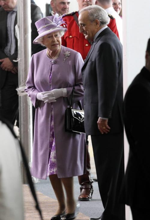 MIKE.DEAL@FREEPRESS.MB.CA 100703 - Saturday, July 03, 2010 -  Her Majesty Queen Elizabeth II arrives at the James Armstrong Richardson International Airport in Winnipeg, MB. Queen Elizabeth II is accompanied by Mr. Arthur Mauro, Chair of the Board of Directors of Winnipeg Airports Authority. Queen Elizabeth II and Prince Philip the Duke of Edinburgh were the first passengers of a flight to be processed at the new airport terminal. MIKE DEAL / WINNIPEG FREE PRESS