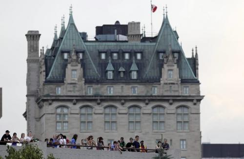 MIKE.DEAL@FREEPRESS.MB.CA 100703 - Saturday, July 03, 2010 -  The Fort Garry Hotel rises above a crowd gathered on top of the parking garage at the Forks to watch Queen Elizabeth II a Scocia Bank Stage. MIKE DEAL / WINNIPEG FREE PRESS
